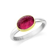 FACETED TOURMALINE RING SET IN 18CT GOLD ON SILVER BAND